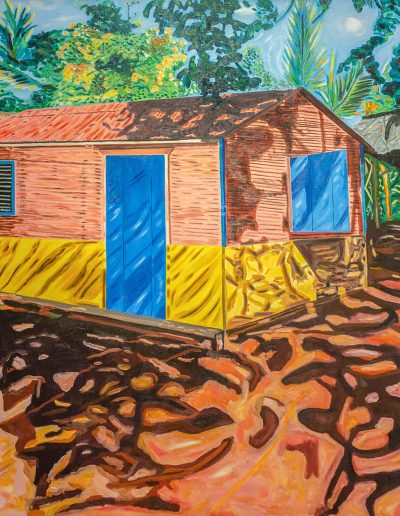 A small shack in the middle of a colorful forest.