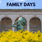 This is a photo of a building with a flat roof and a green statue of an Indigenous person in front of the building. The statue of the person has their right hand on their forehead and is wearing a large feathered hat. There are also vibrant yellow plants in-front of the state. In the sky above the building reads the words in black "Family Days".